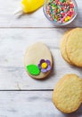 Cookies with decorations tools Ã¢â¬â icing, marzipan flower, nonpareil Royalty Free Stock Photo